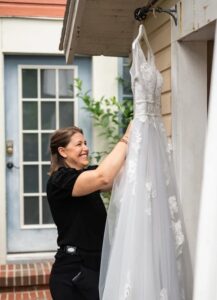 Masterpiece weddings planner getting the brides dress ready