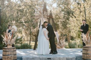 Wedding in court yard with arch